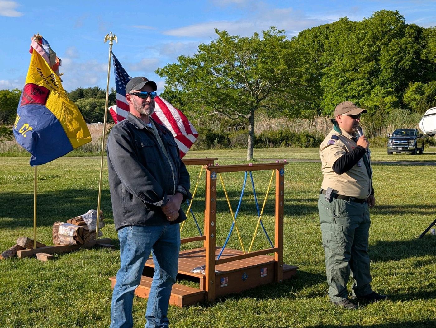 Leaders and Scouts at an outdoor flag ceremony