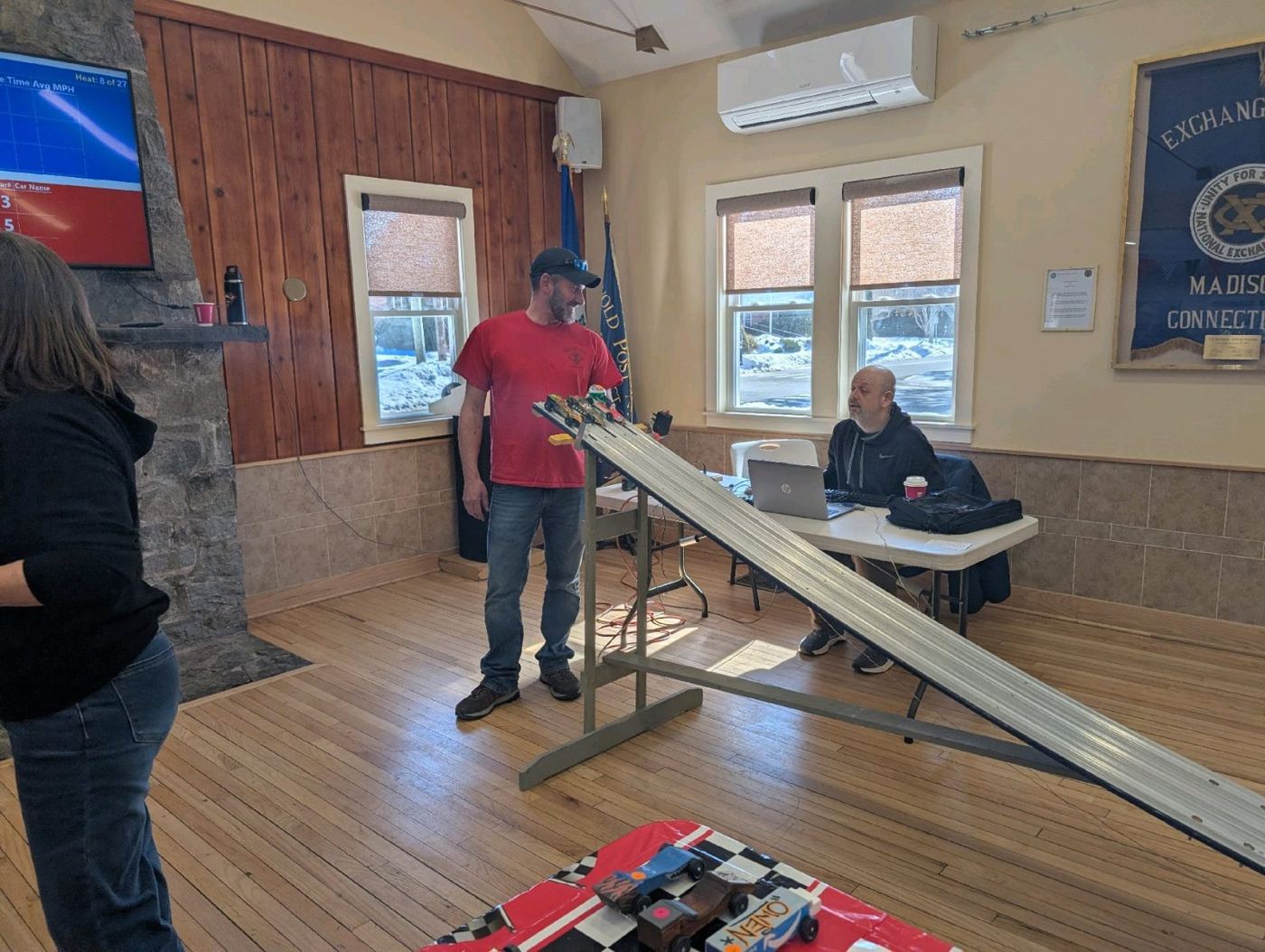 A Pinewood Derby track set up in a hall